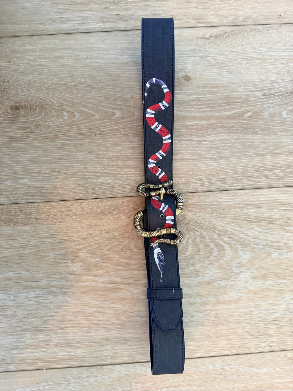 Black Synthetic Leather Belt with Red & White Snake Motif and Gold Buckle